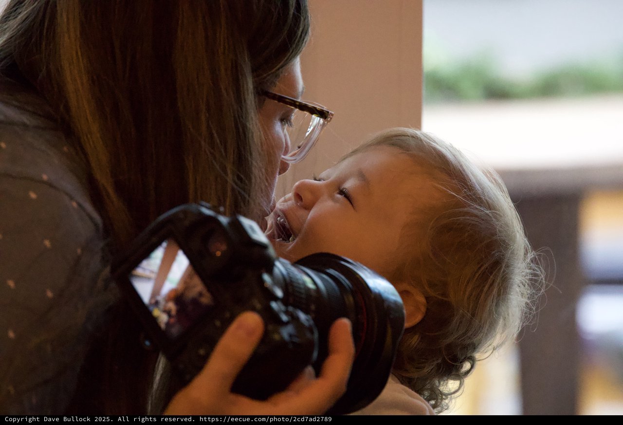 Joyful Mother and Child Moment During Christmas Season