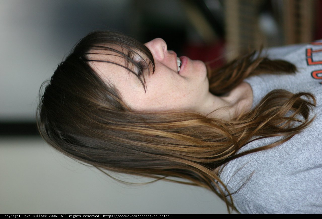 Candid Portrait of a Young Woman Laughing Softly