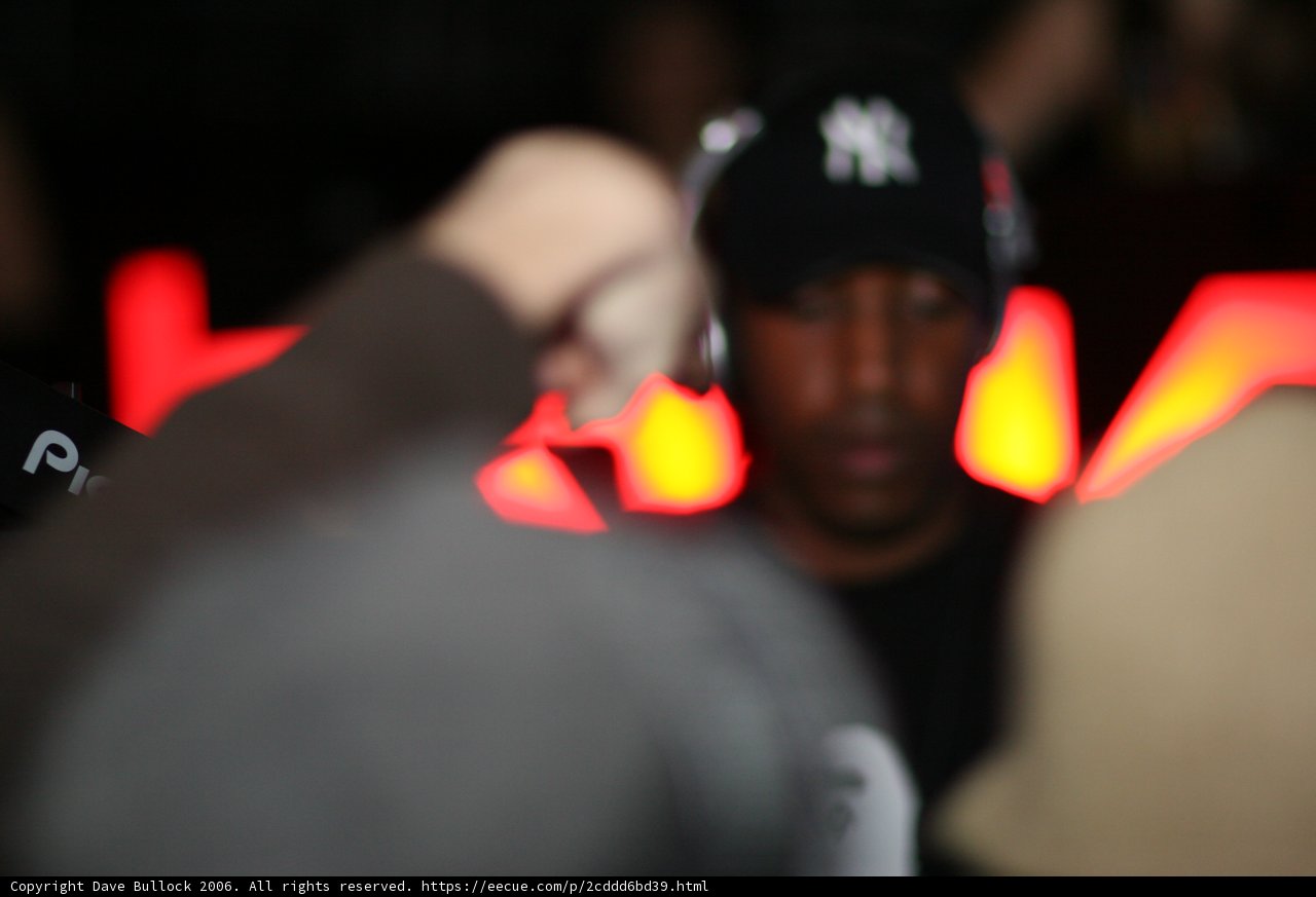 Hat-wearing Man in a Crowded Club