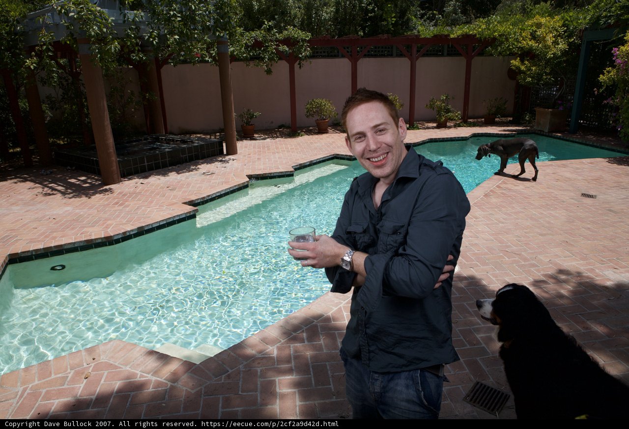 A Man and His Dog by the Pool