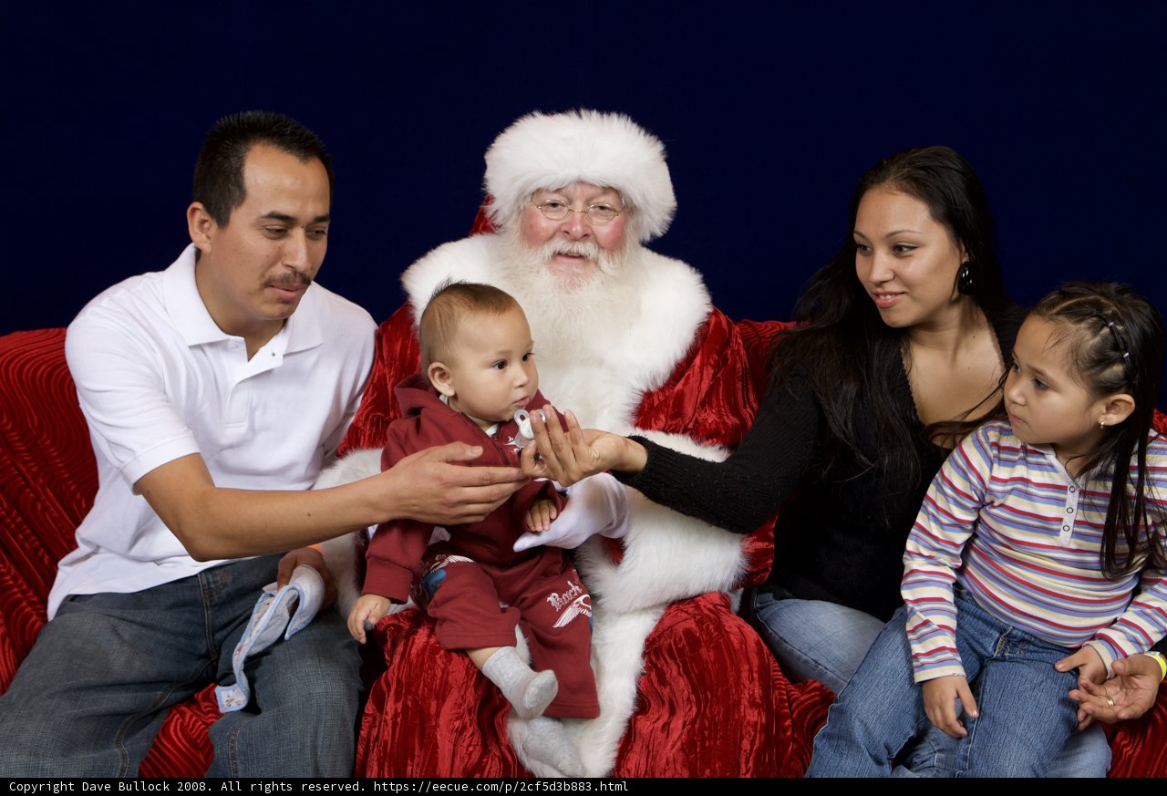 A Family's Festive Moment with Santa Claus