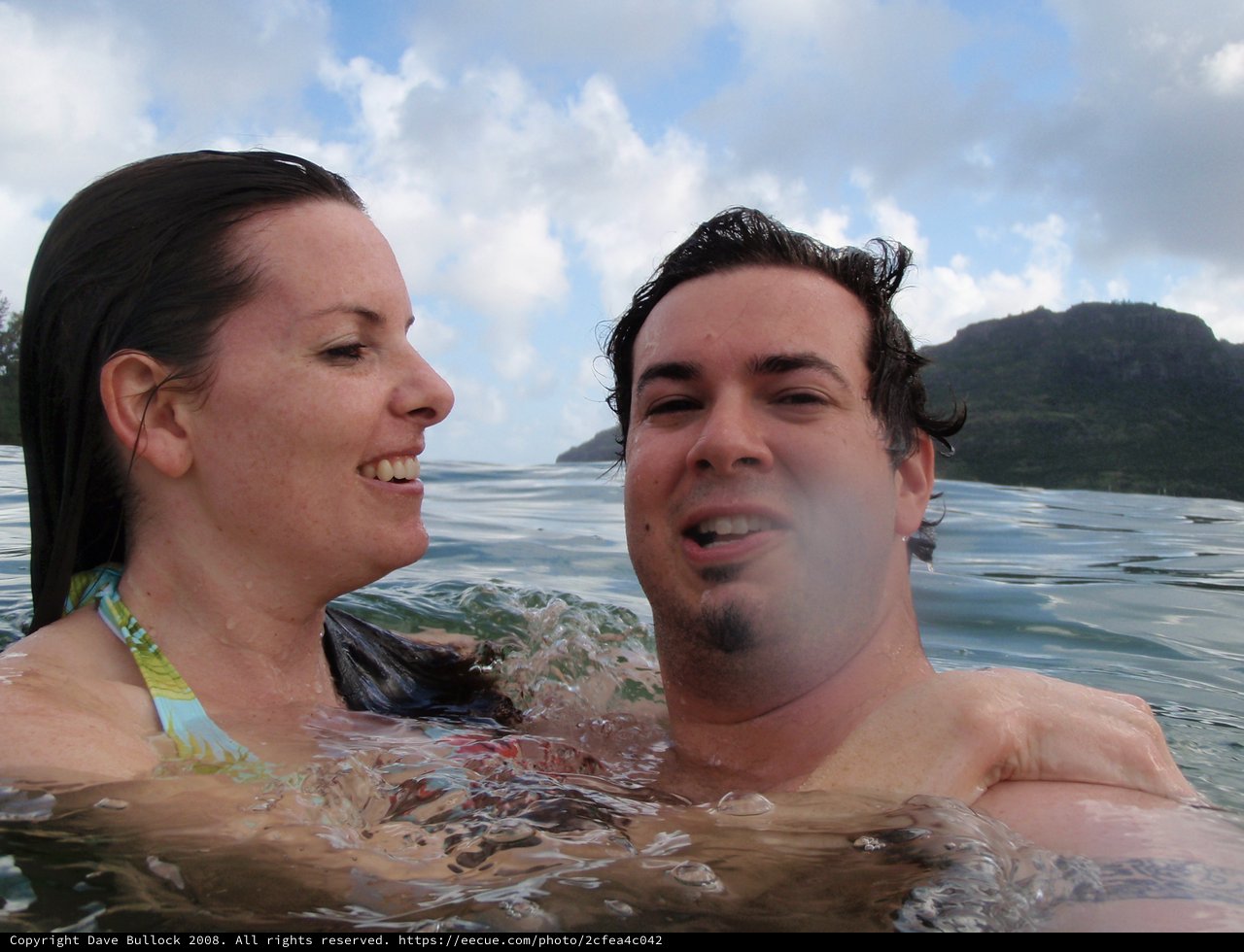 Couple Laughing Together in Hawaiian Waters