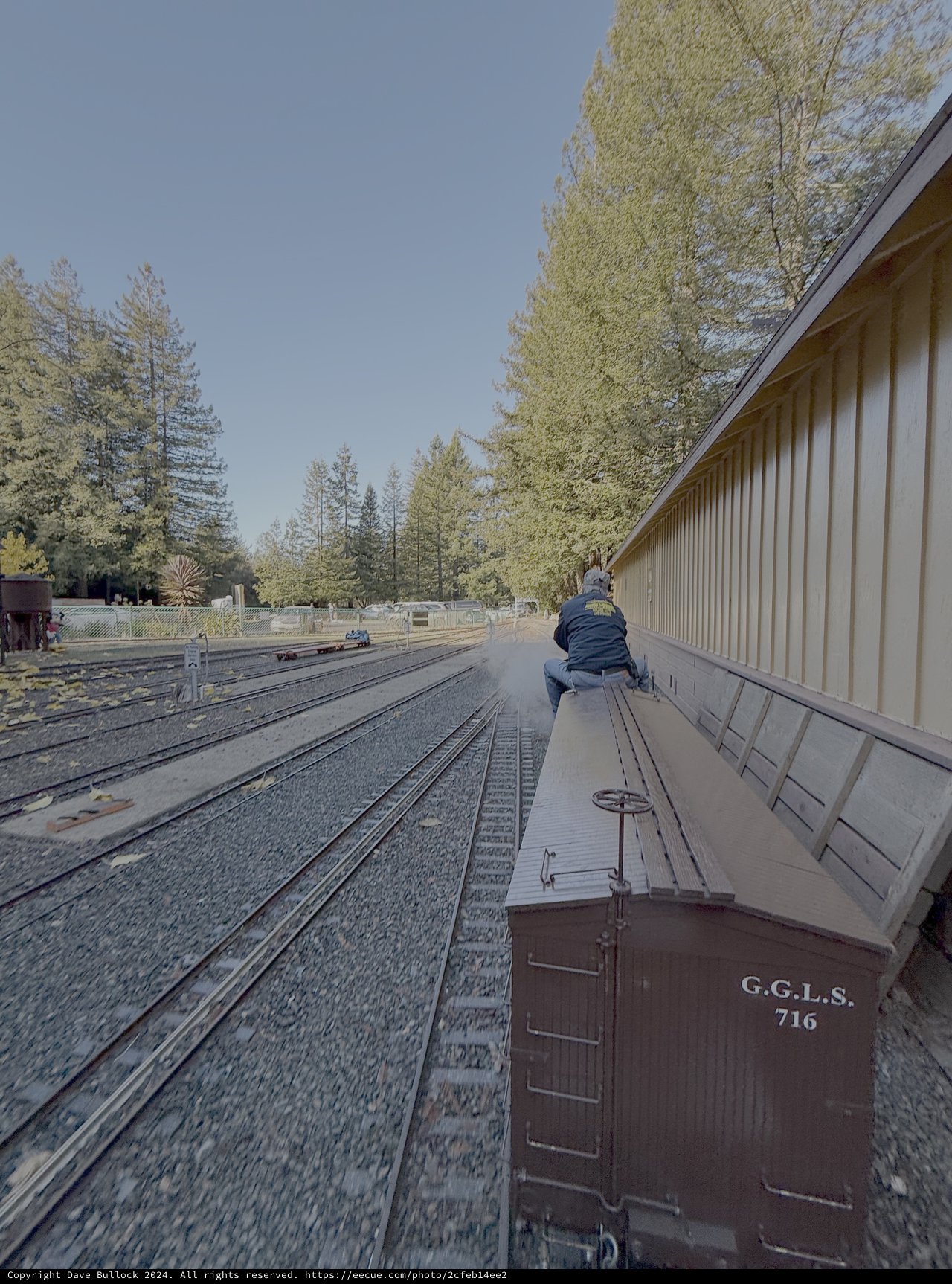 Vintage Train Car on Railroad Tracks