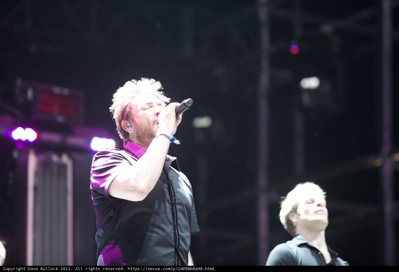 Two Men Rocking the Stage with Light and Sound