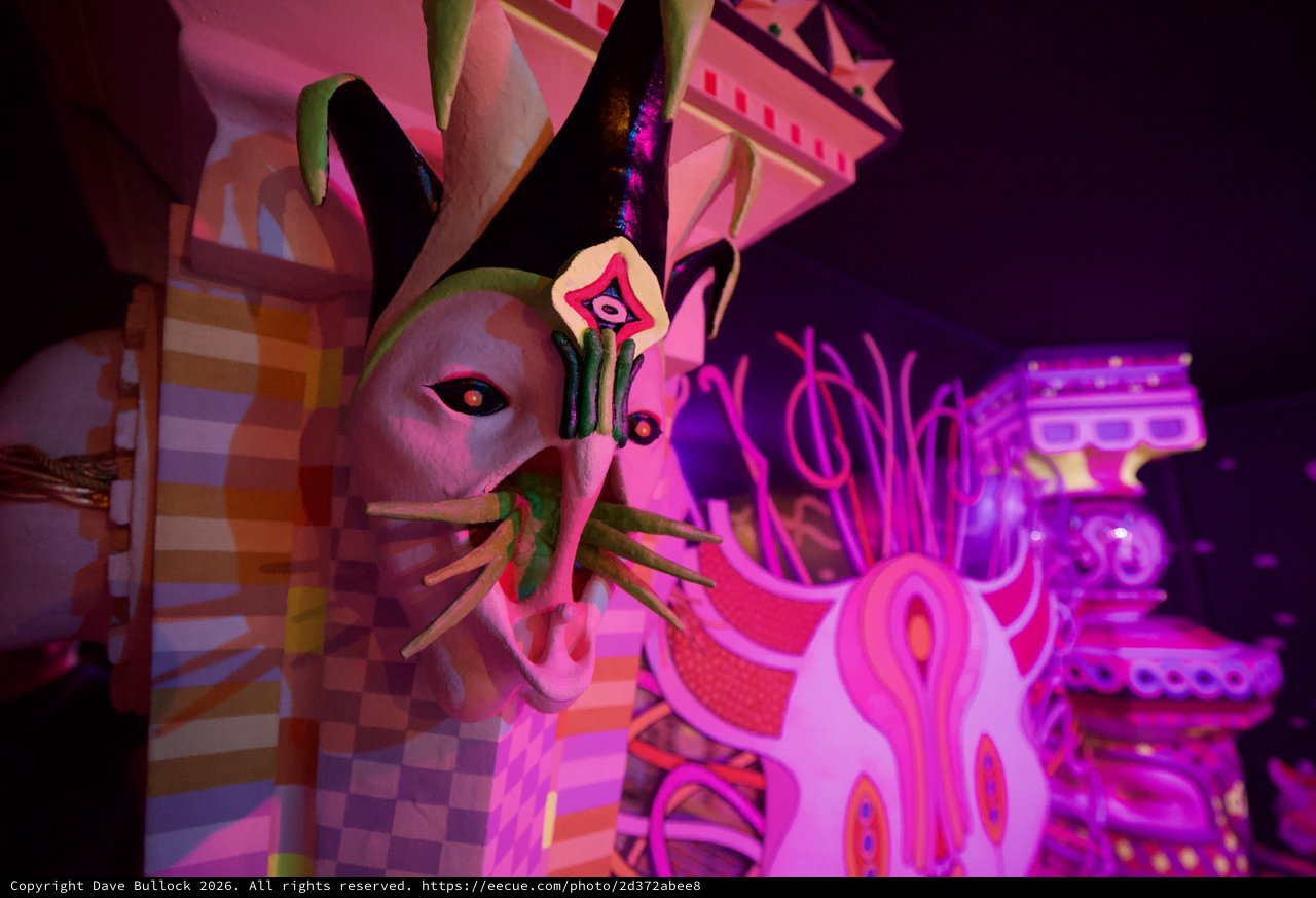 Surreal Pink Illuminated Sculpture in Dark Gallery