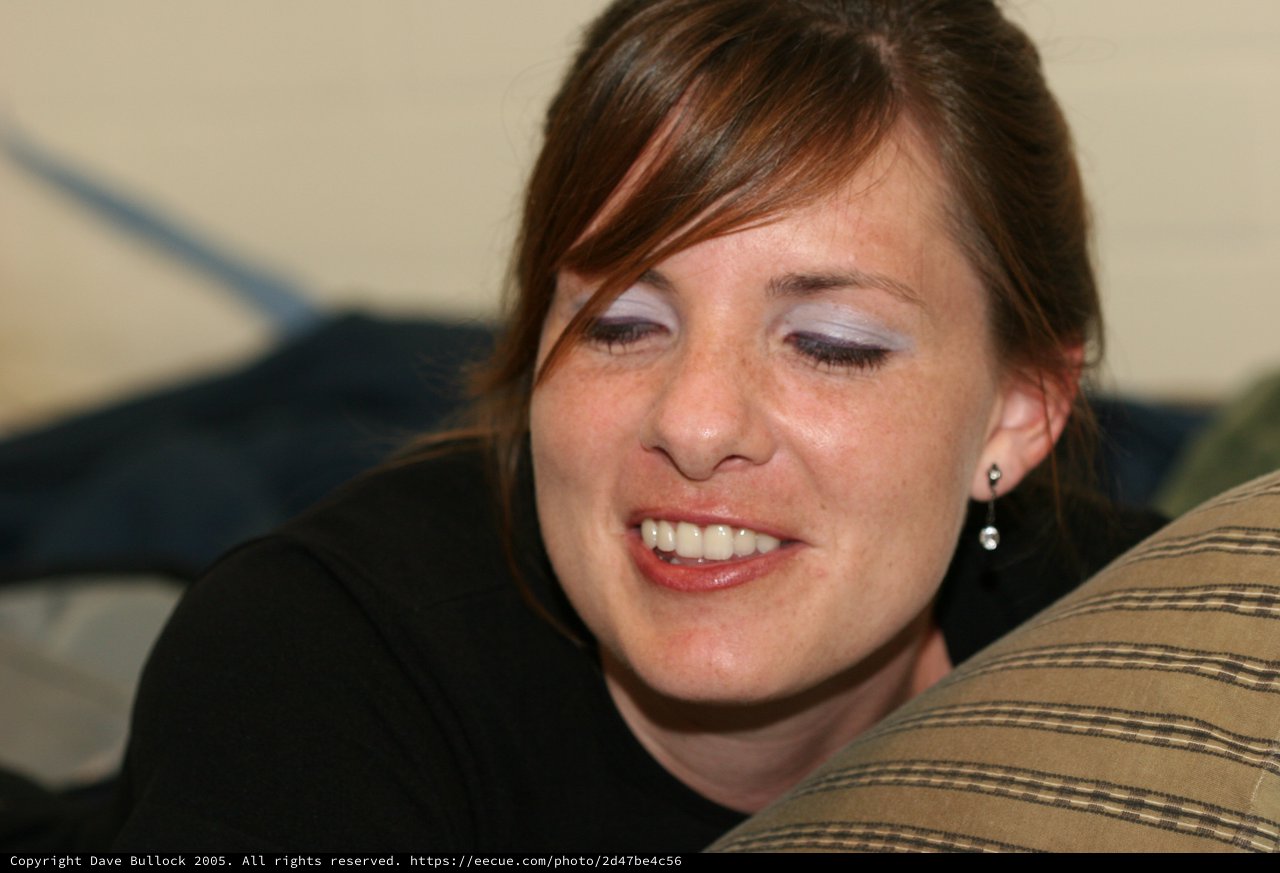 Candid Portrait of a Smiling Young Woman Indoors