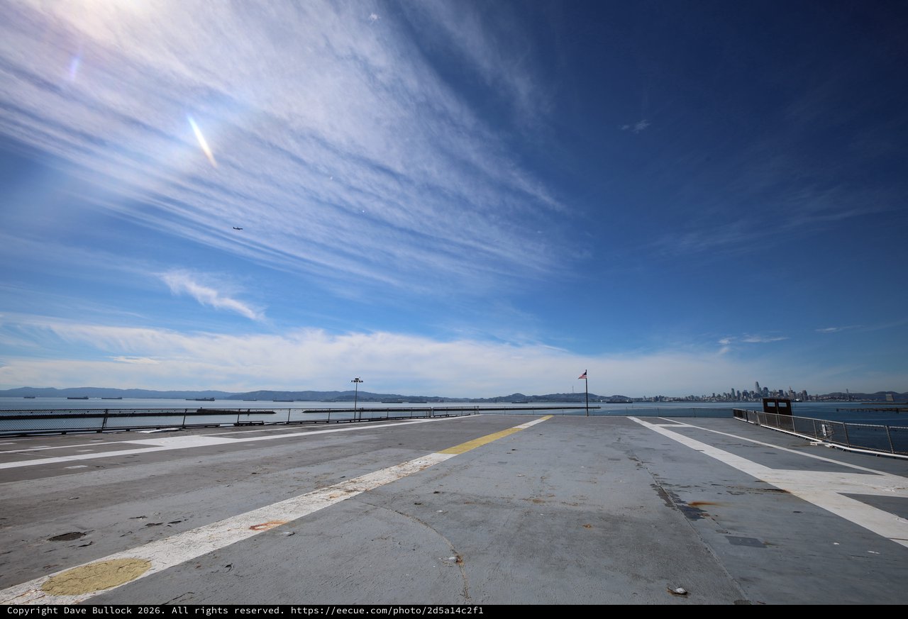 Wide Aircraft Carrier Flight Deck with Distant Skyline