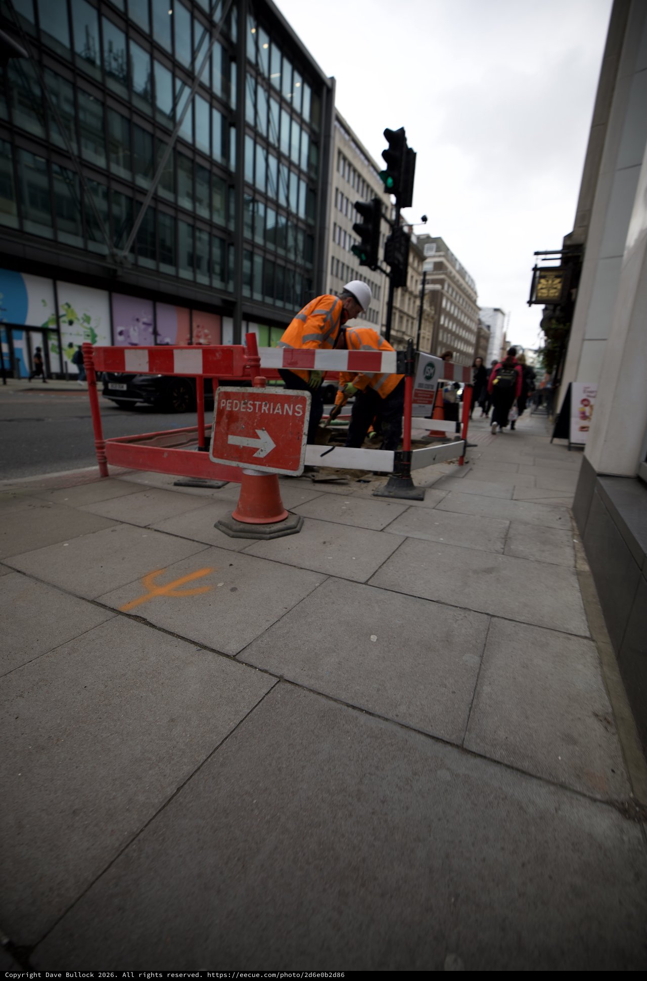 Construction Worker on London Street During Roadwork
