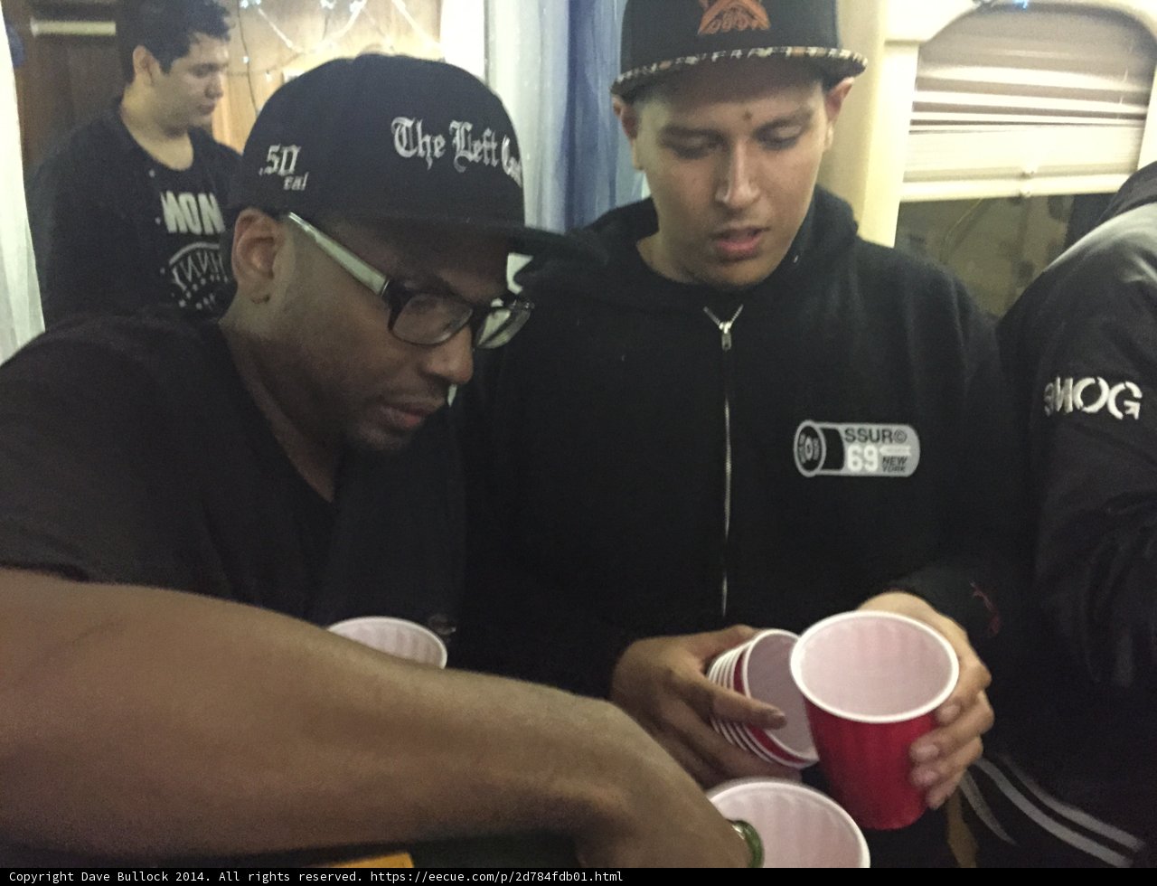 Two Men Enjoying Their Cups