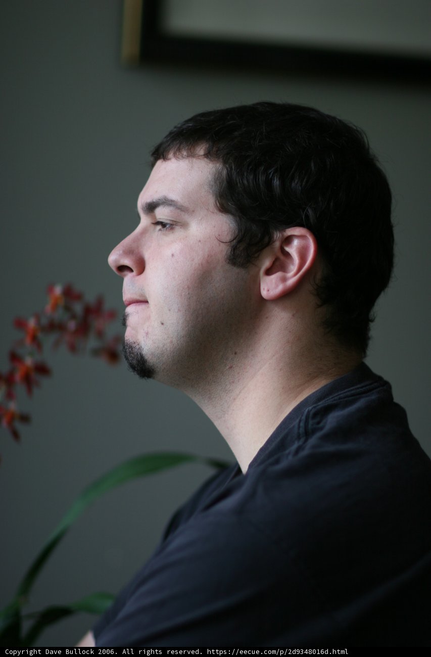 Man with a Black Shirt and a Flower