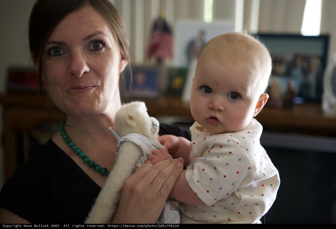 Mother and Baby Share a Playful Moment Indoors