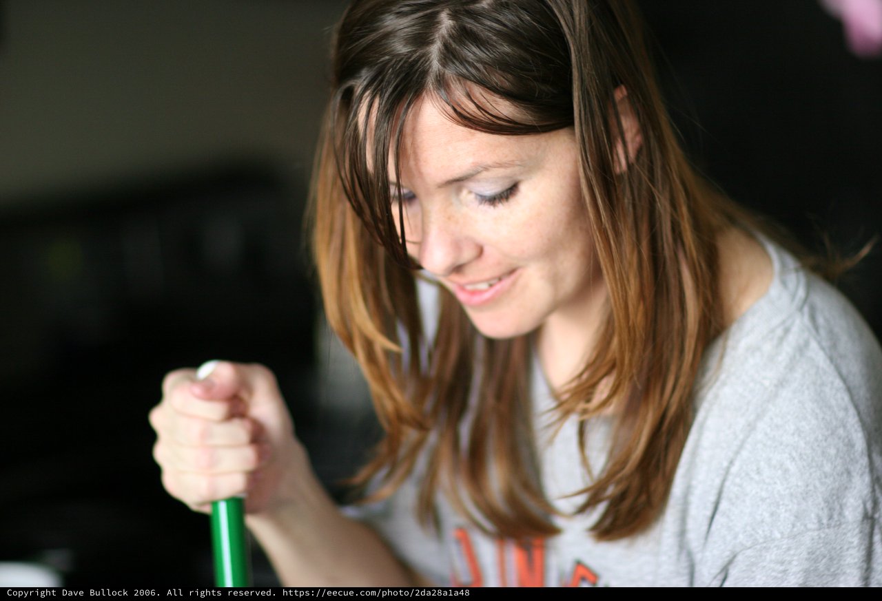 Young Woman Smiling While Working Indoors