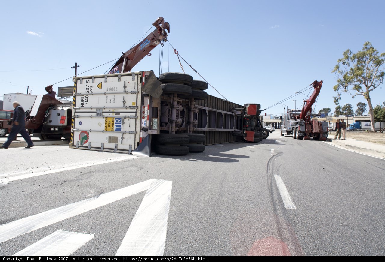 Truck Lifted by Crane