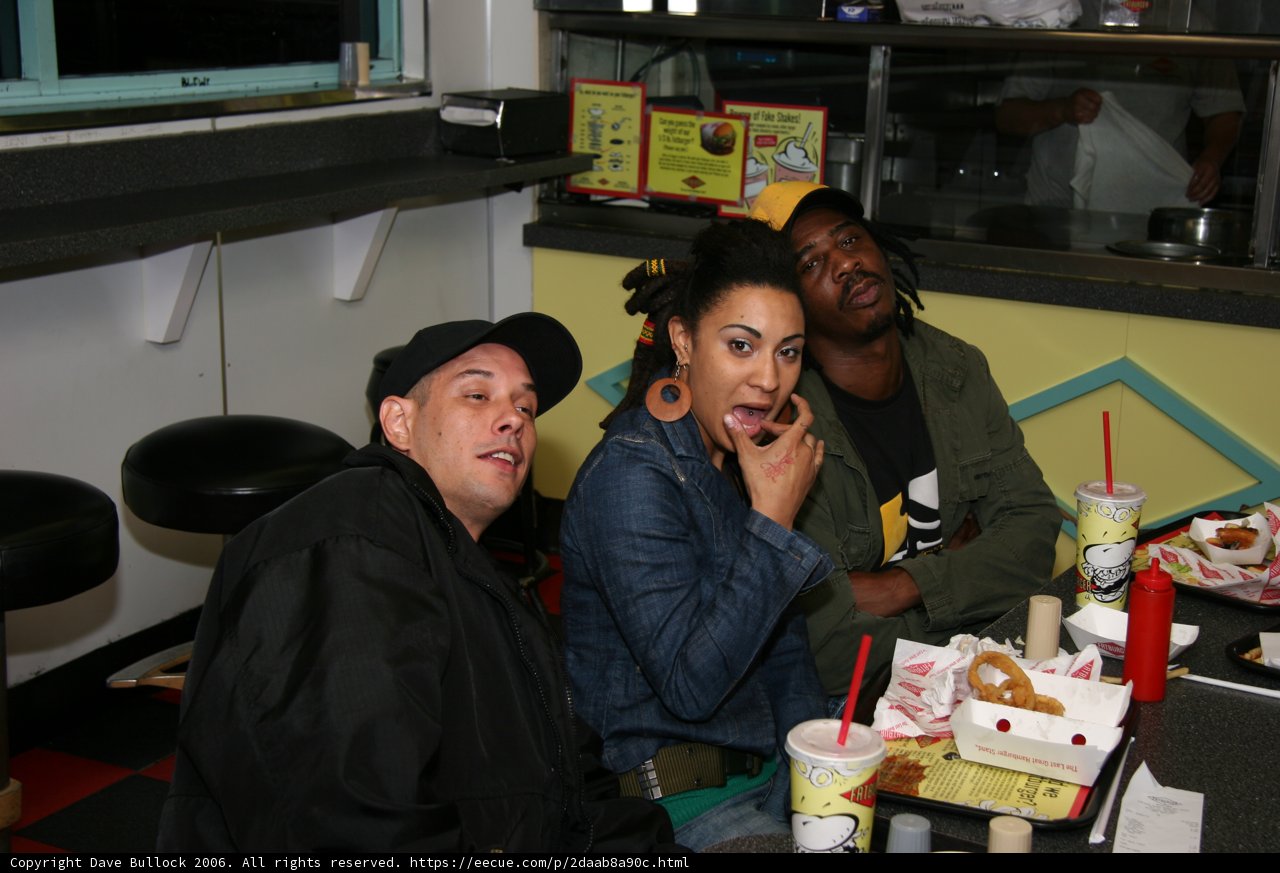 Man in Black Jacket having Lunch with Friends