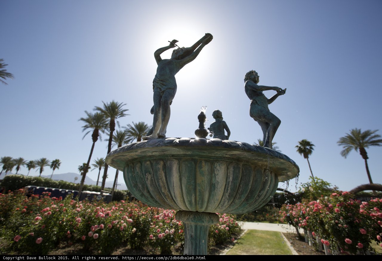Serenity in Stone: Three Statues and a Fountain in the Garden