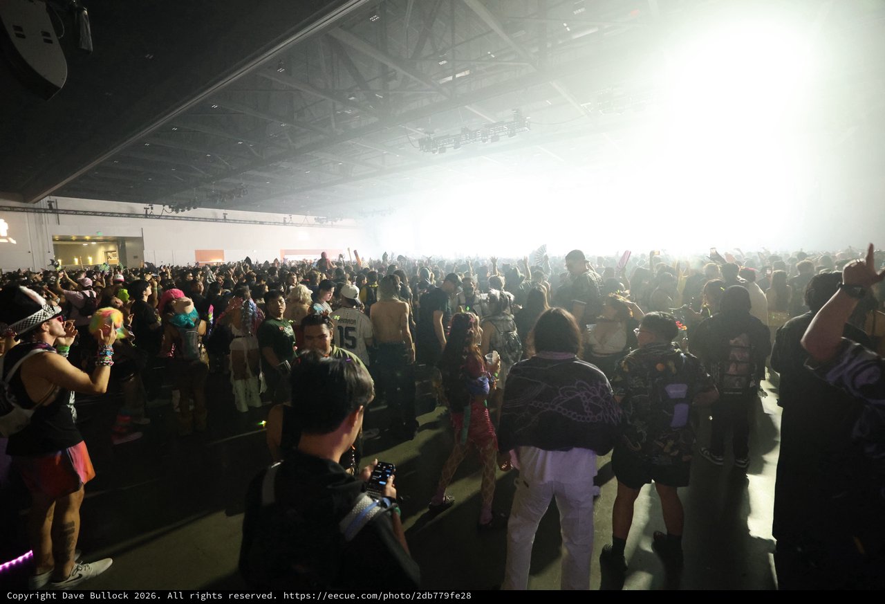 Massive Indoor Rave Crowd Erupts Under Blinding Stage Lights