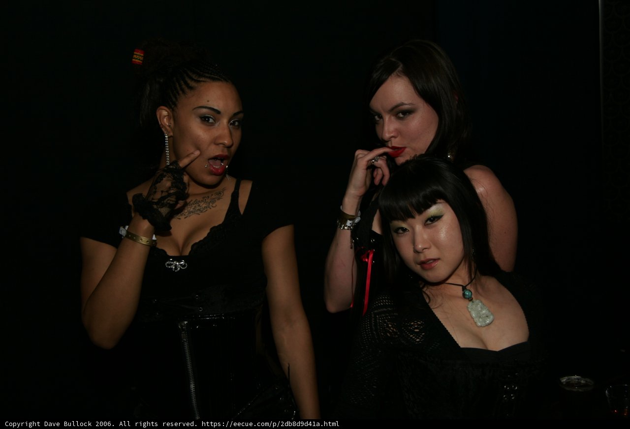 A Trio of Women in Black Strike a Pose