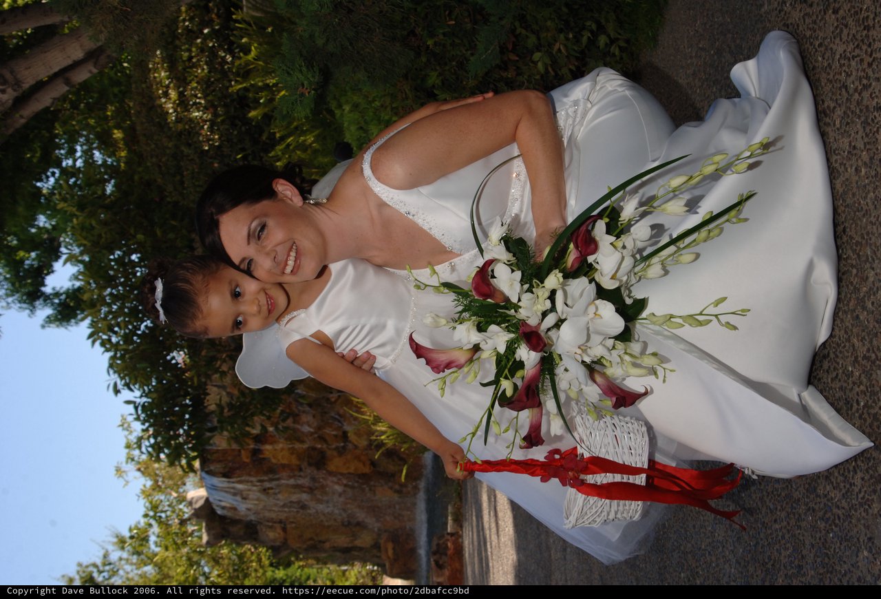 Bride and Flower Girl Share a Tender Wedding Moment
