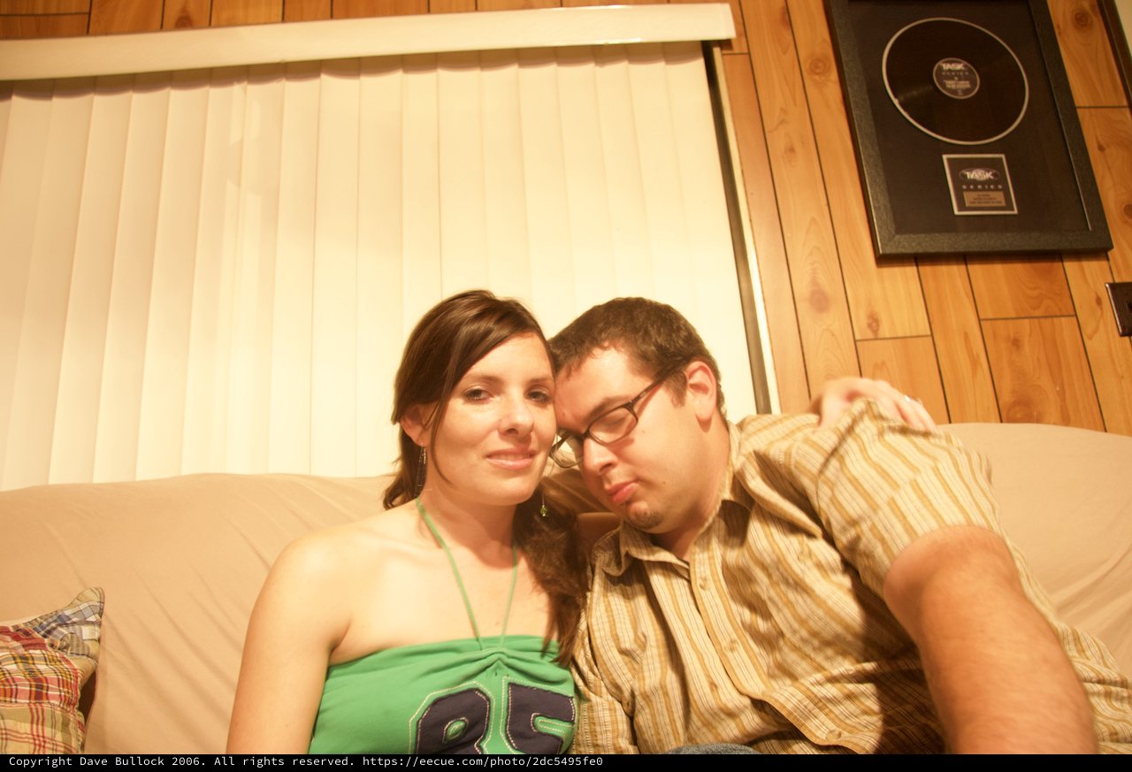 Couple Relaxing Together on Couch at Home