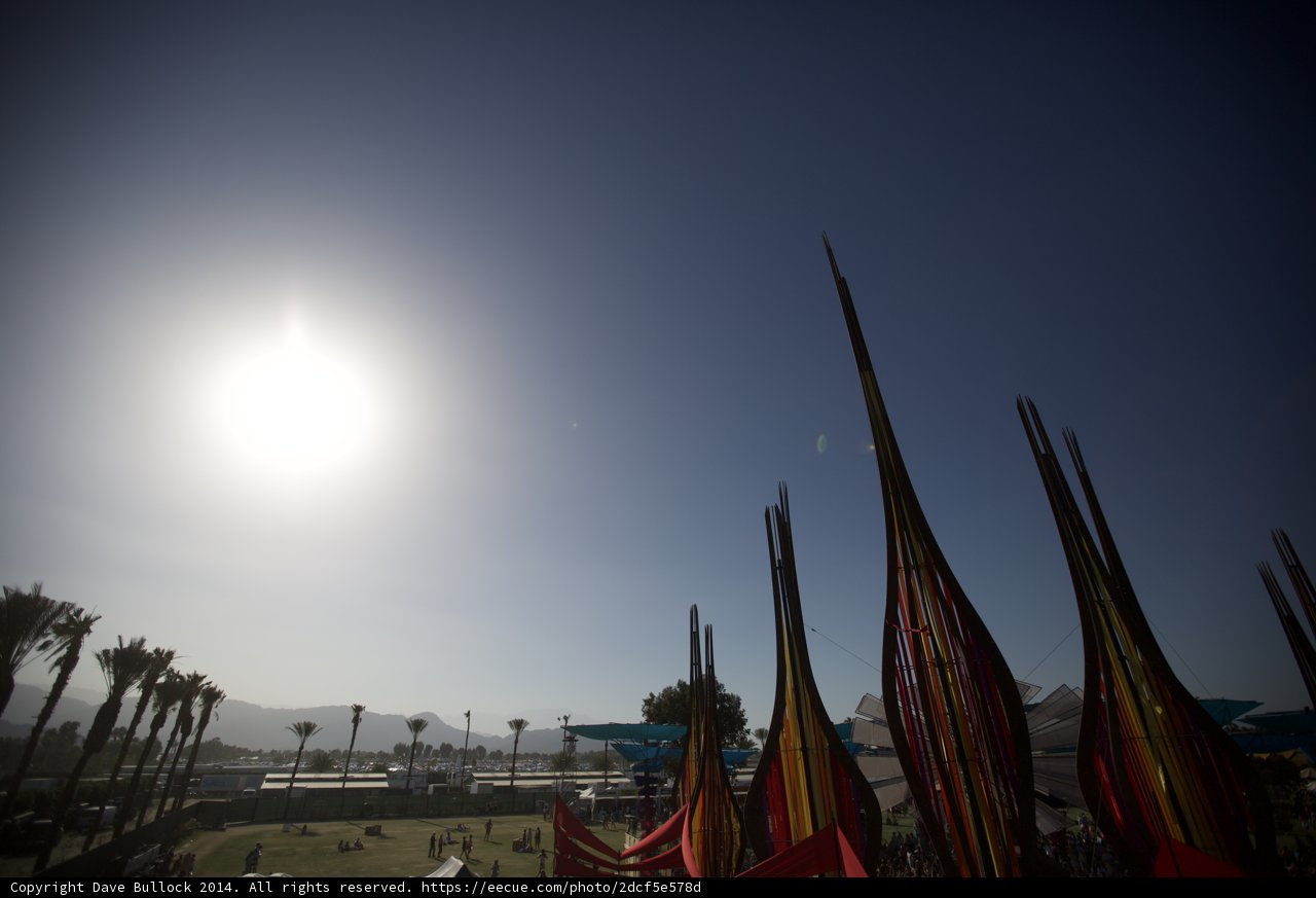 Bright Sun and Flags at the Beach