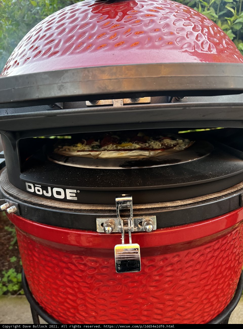 Grilled Pizza on a Red BBQ Grill