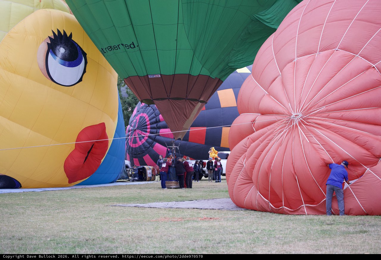 Ground Crew Prepares Colorful Balloons at Classic Festival