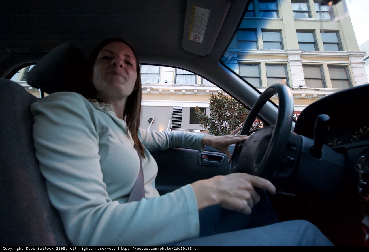 Woman Behind the Wheel in Urban Downtown Setting