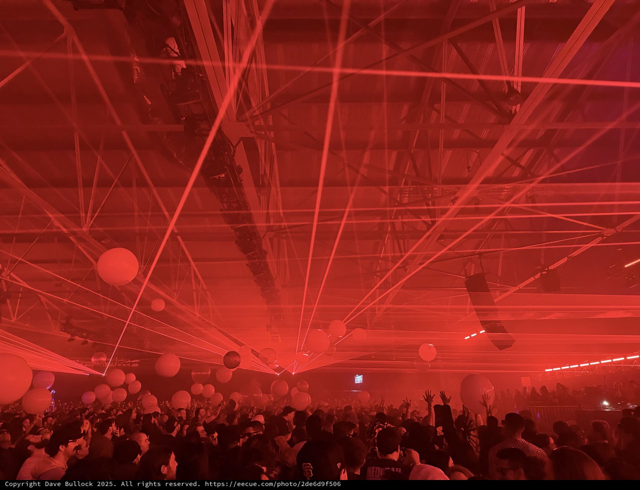 Intense Red Laser Light Show at Electronic Music Concert