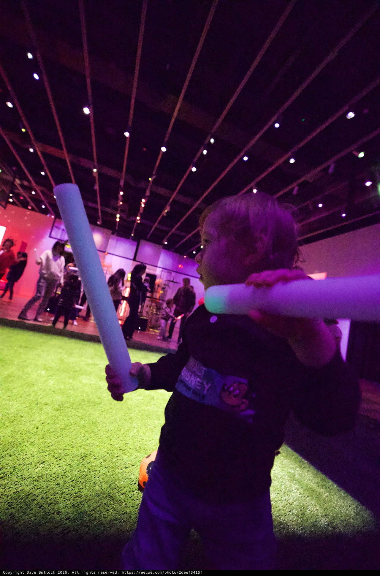 Child with Light Saber at Baby Rave Event