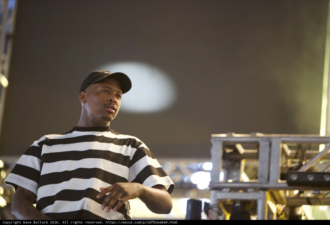 YG Lights Up the Stage in Stripes and a Cap