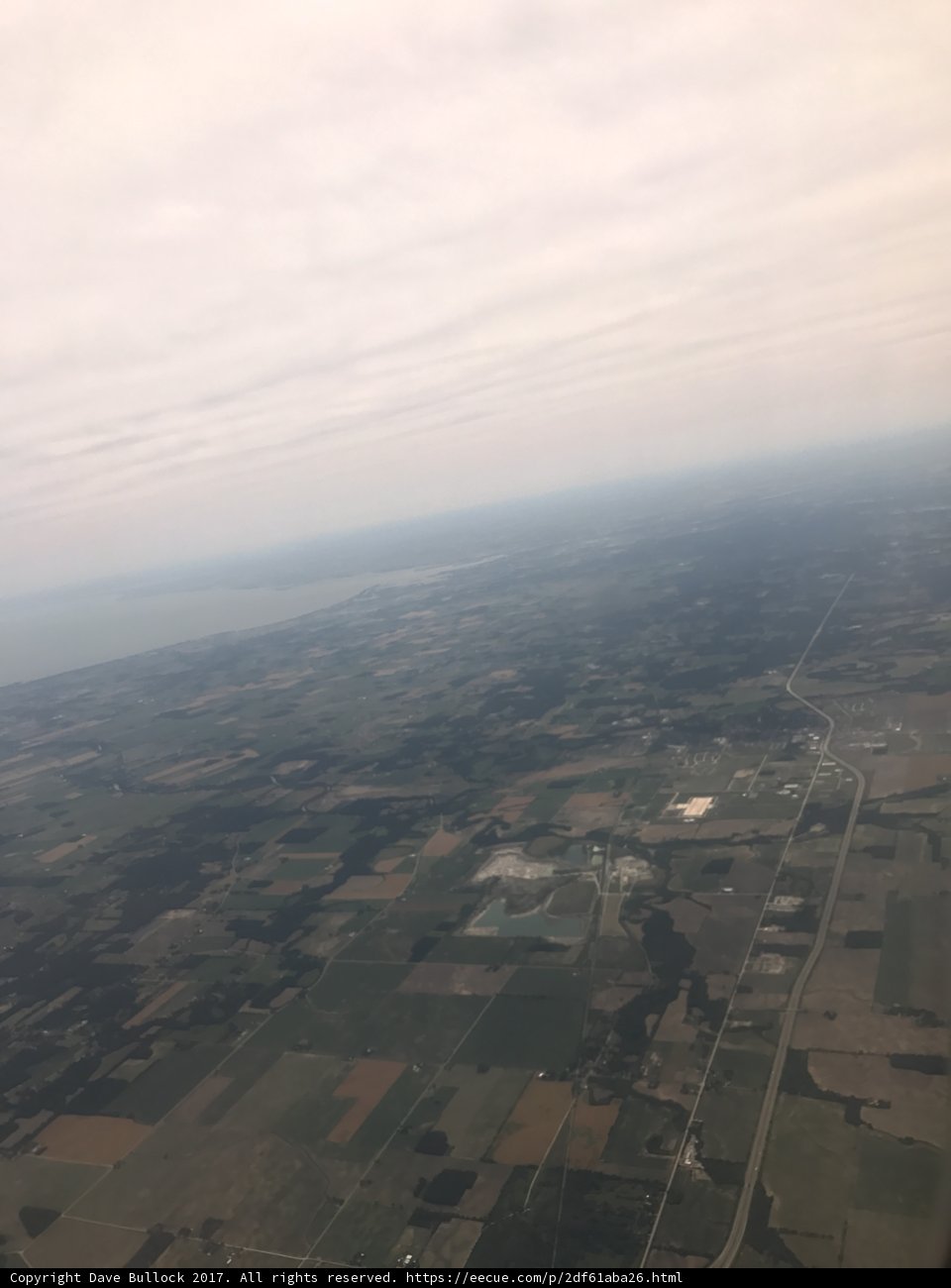 Aerial View of Lush Farmland and Water