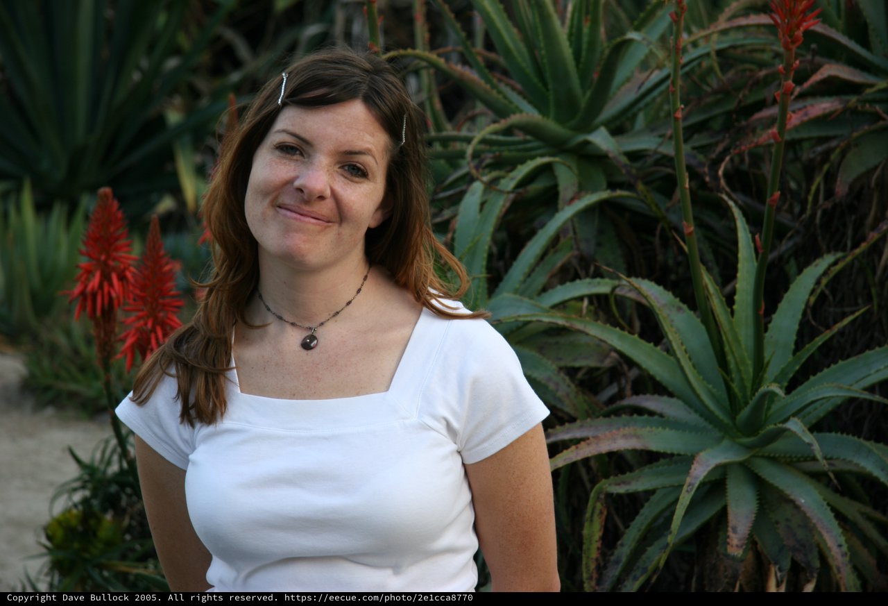 Woman Smiling Amidst Desert Garden Succulents