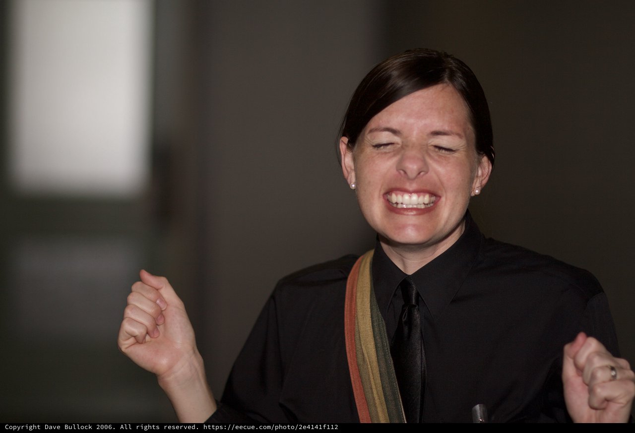 Joyful Woman Celebrating with Triumphant Fist Pump