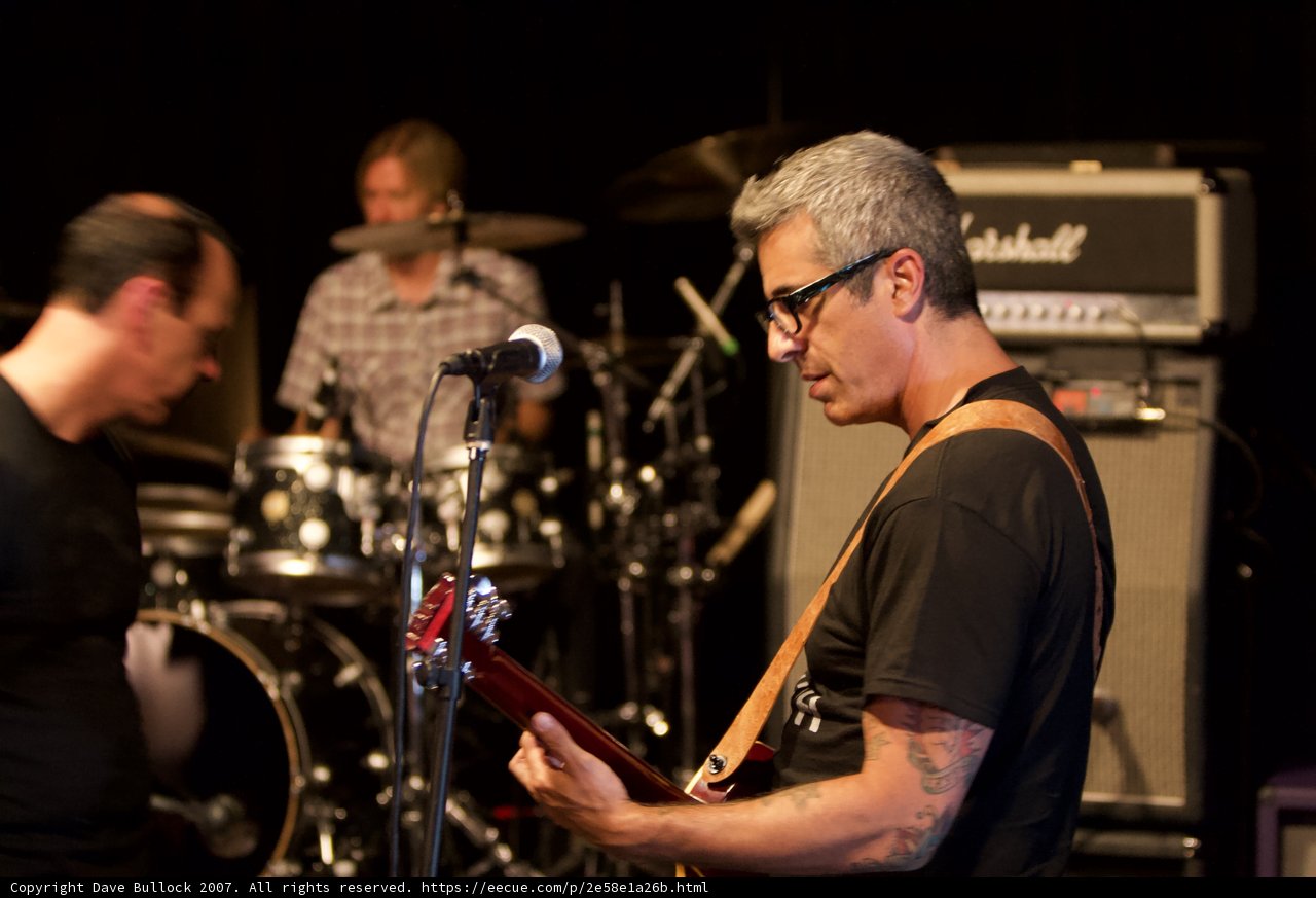 Brett Gurewitz shredding the guitar on stage