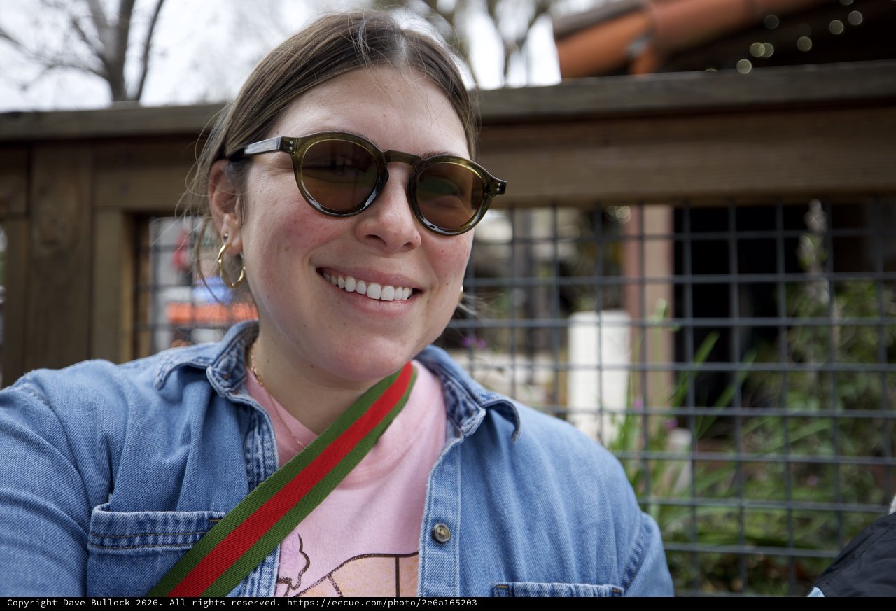 Smiling Portrait at Outdoor Venue in Sunglasses