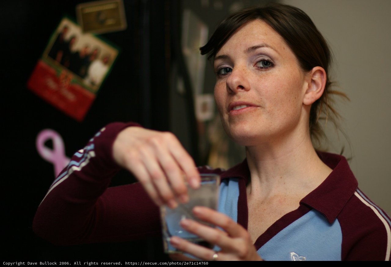 Woman Holding a Glass in Casual Home Setting
