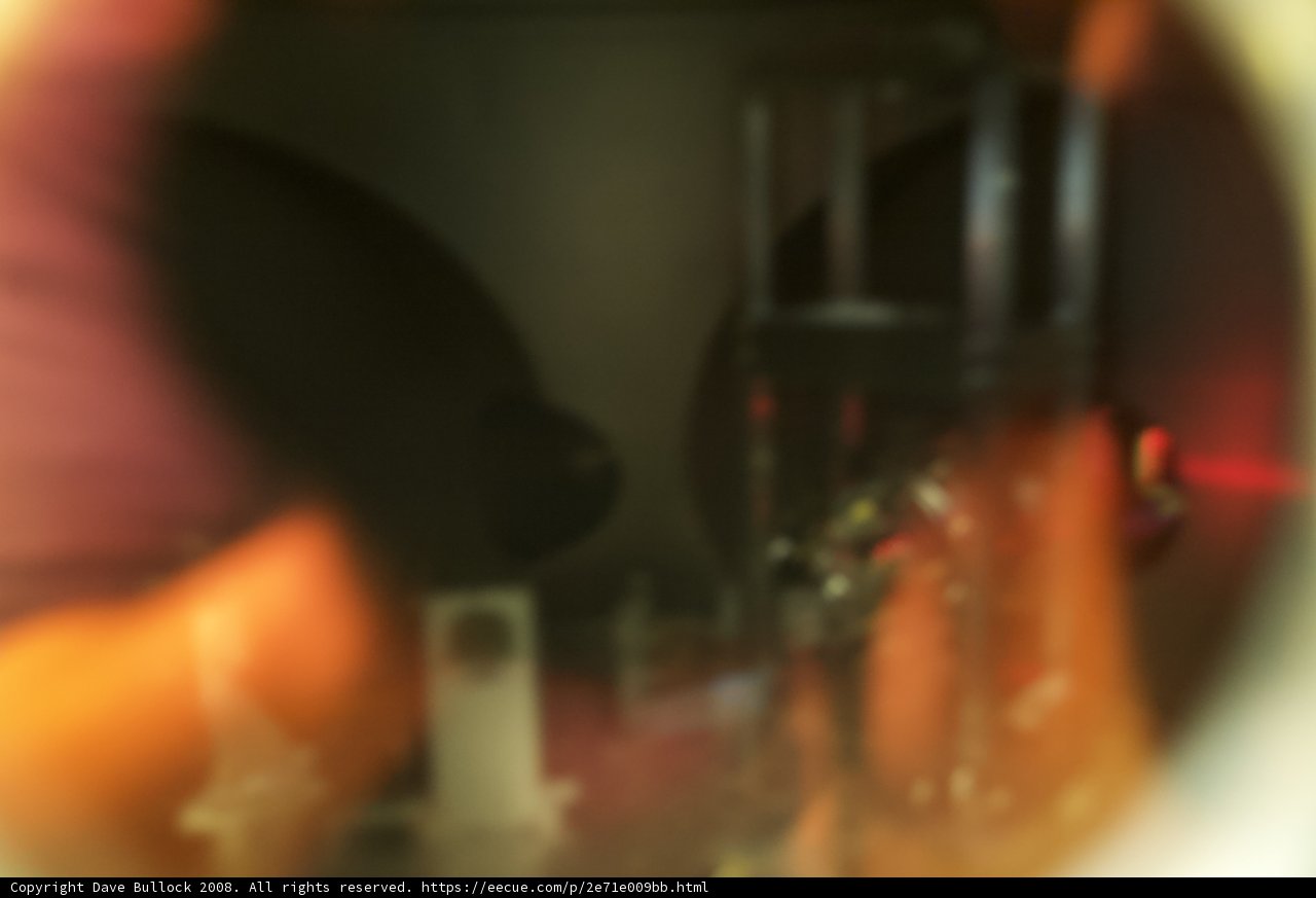 Blurry figure enjoying a drink