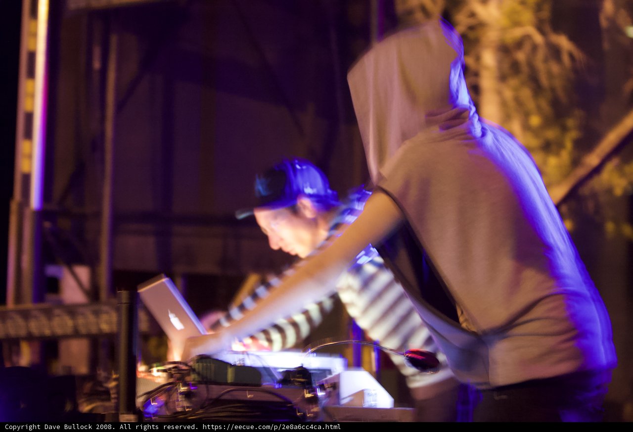 Hoodie-wearing DJ on stage