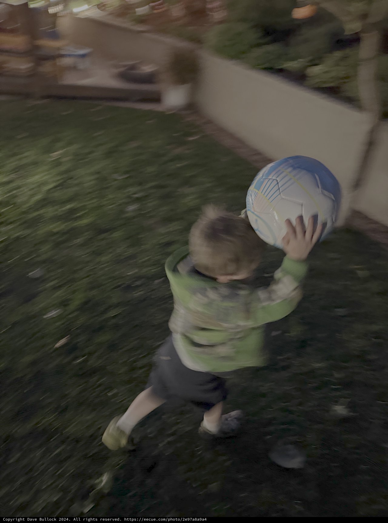 Child Playing with Soccer Ball in Motion