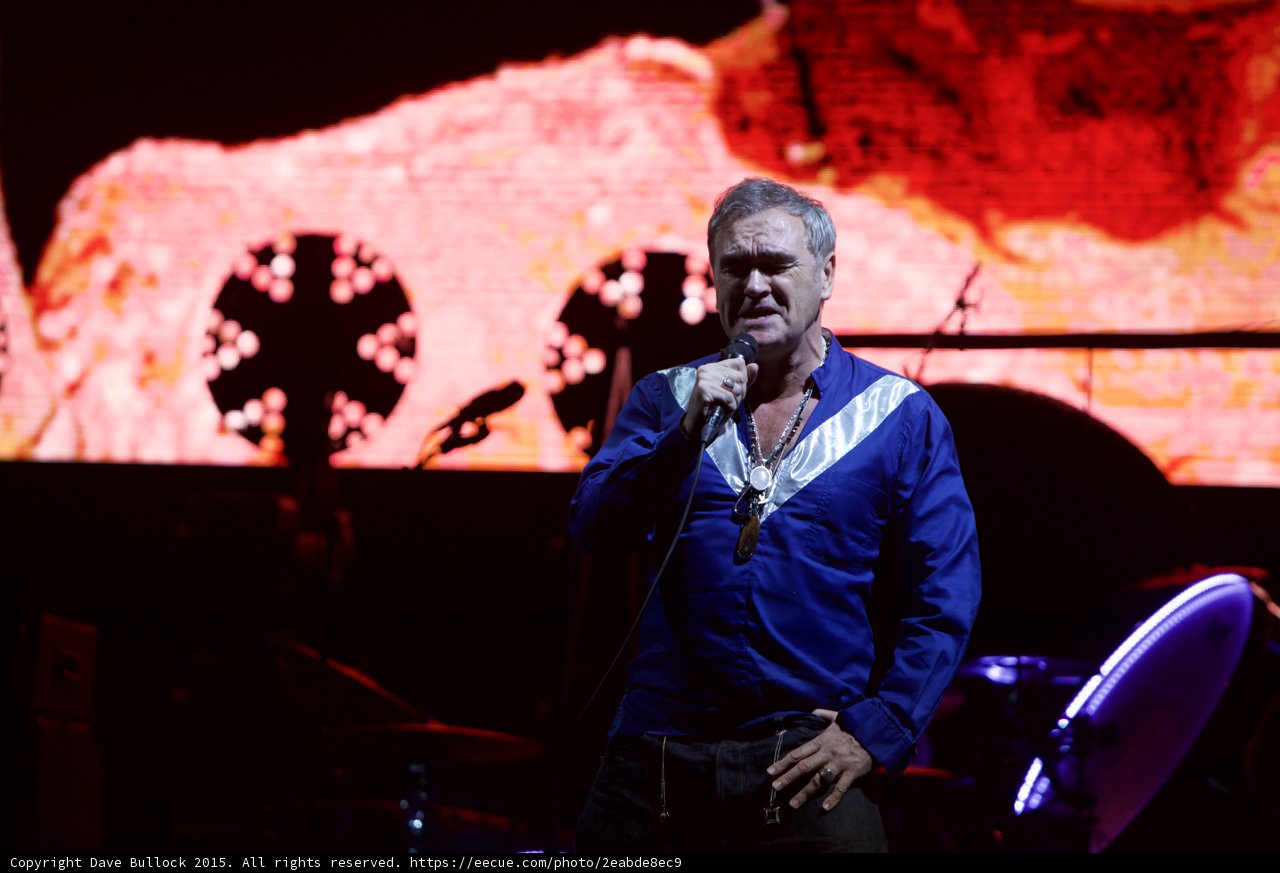 Morrissey Singing Looking Down Blue Shirt Two Circular Lights LED Drum Head Purple Red Orange Screen