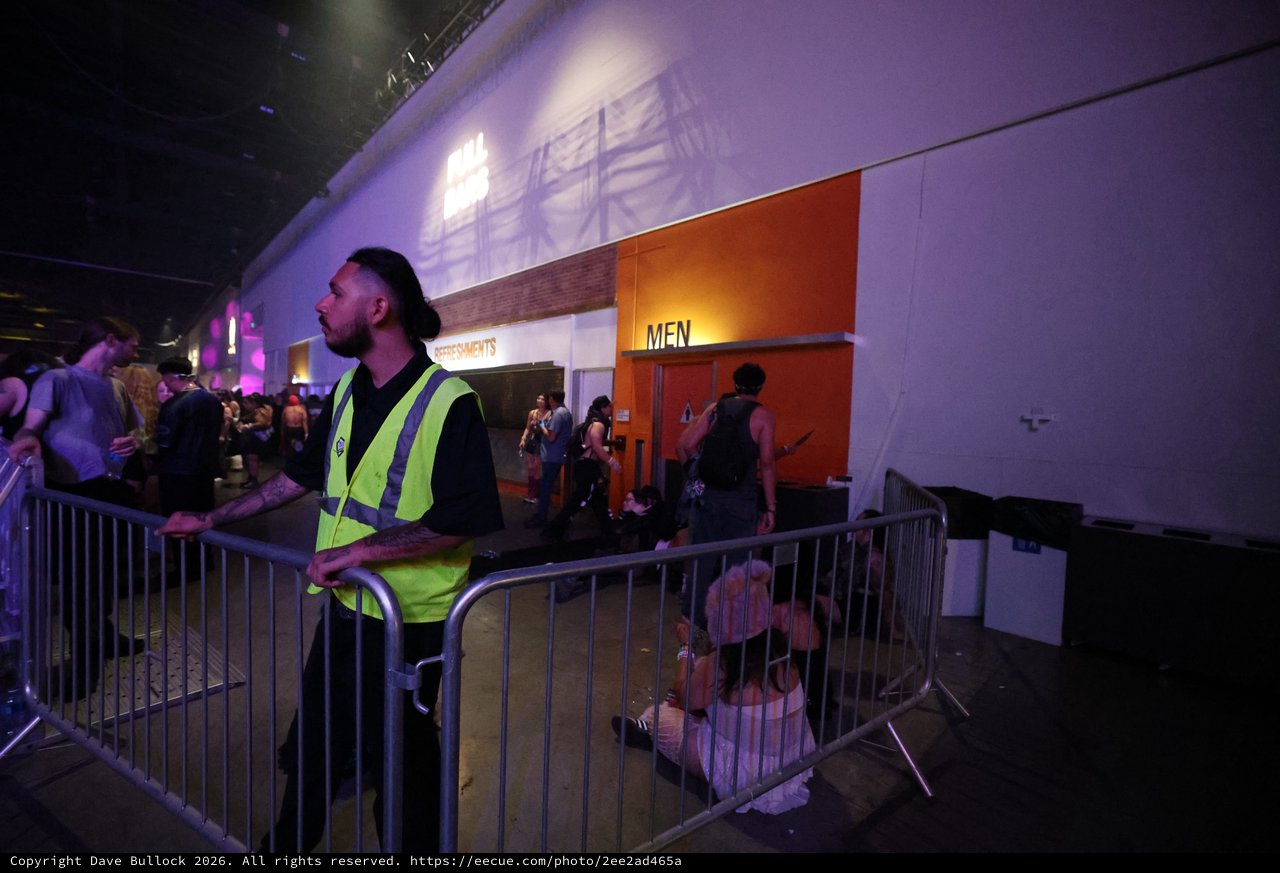 Security Guard Monitors Crowd at Wobbleland Festival
