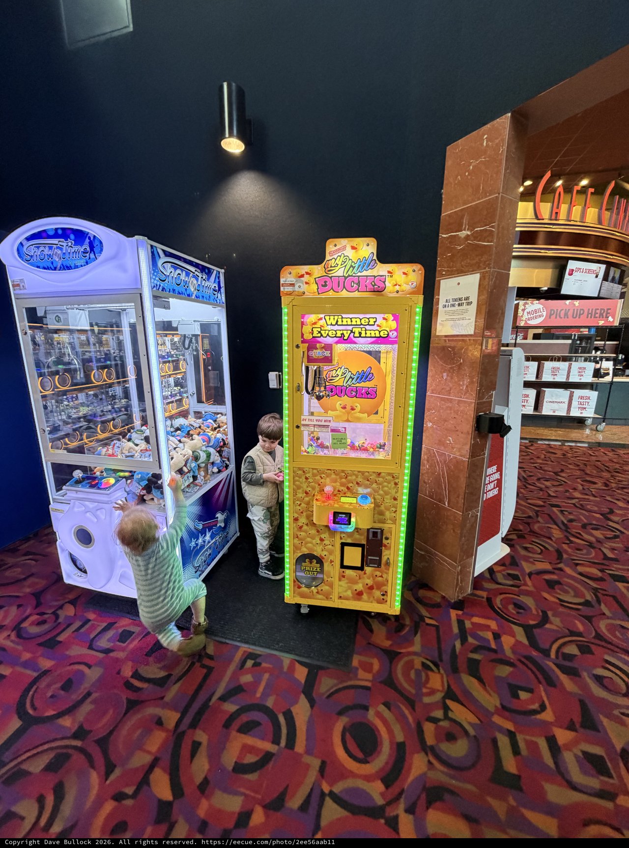 Children Playing Arcade Games at Movie Theater