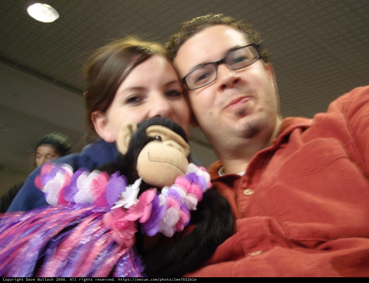 Couple Poses with Monkey Plush and Hawaiian Lei