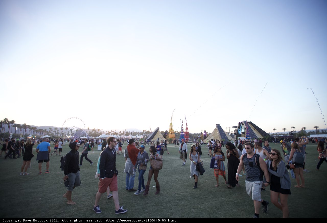Festival-goers frolic in the grass
