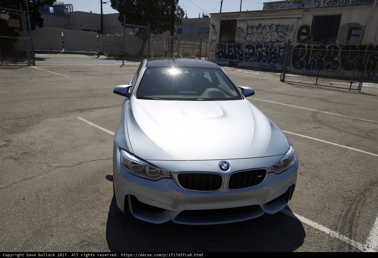 Parked BMW M4 in a Glimmering Parking Lot