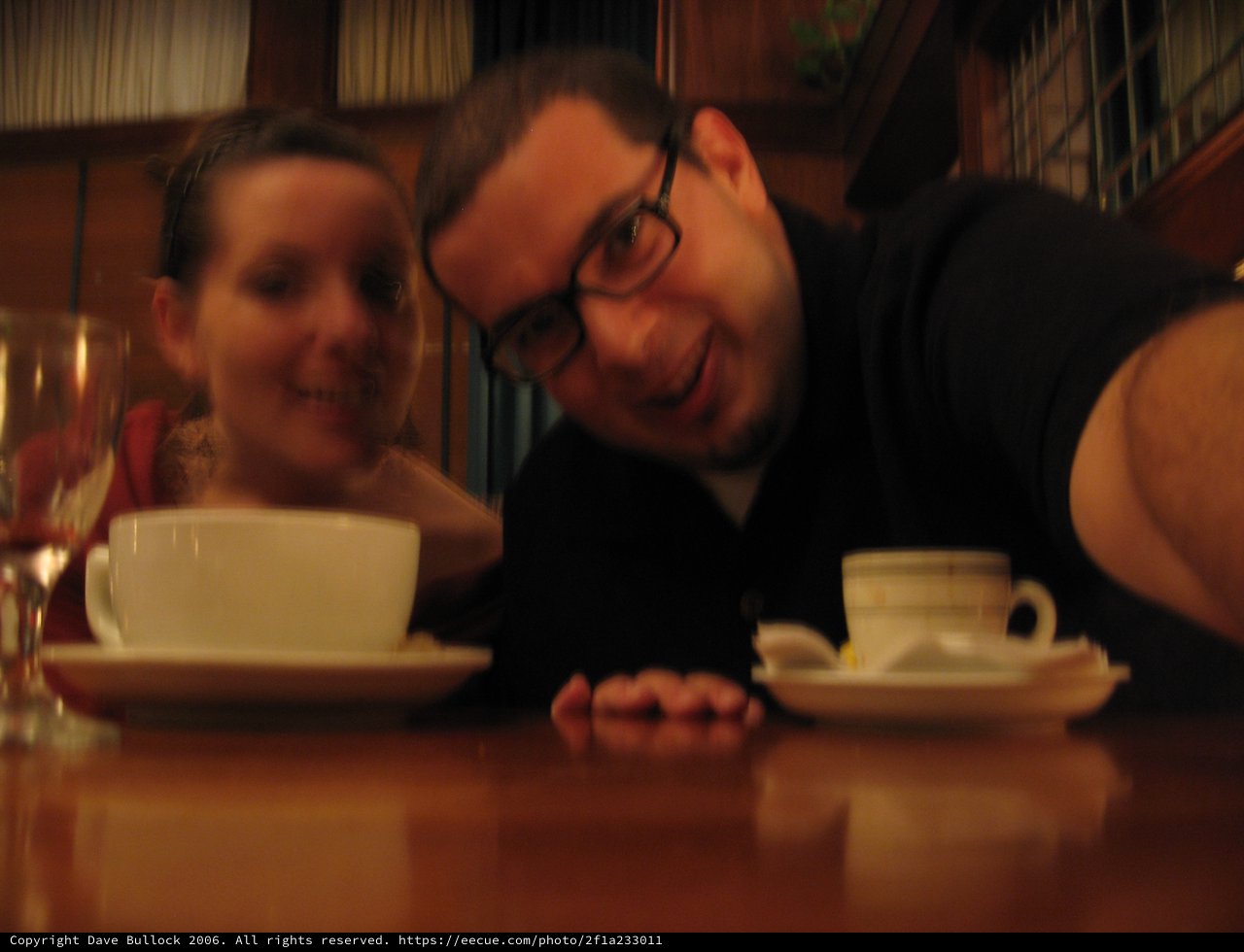 Couple Sharing Coffee at a Cozy Restaurant Table