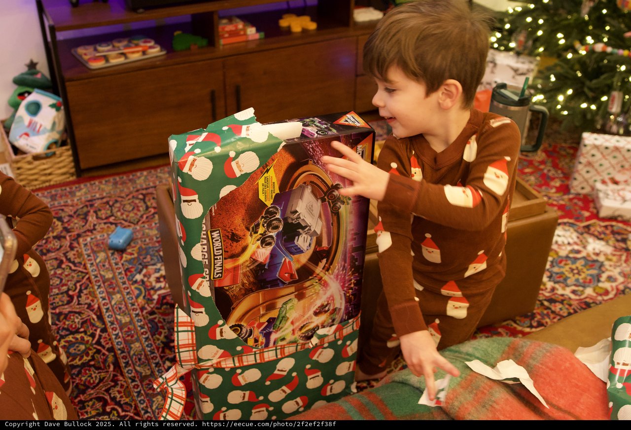 Christmas Morning Joy: Young Boy Opening Presents