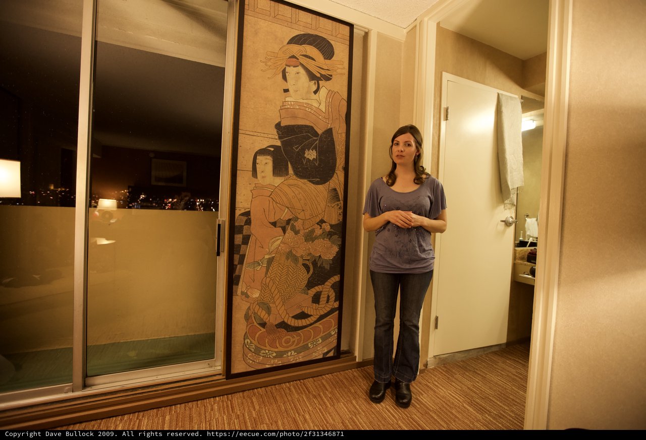 Woman Beside Giant Japanese Art Hotel Room