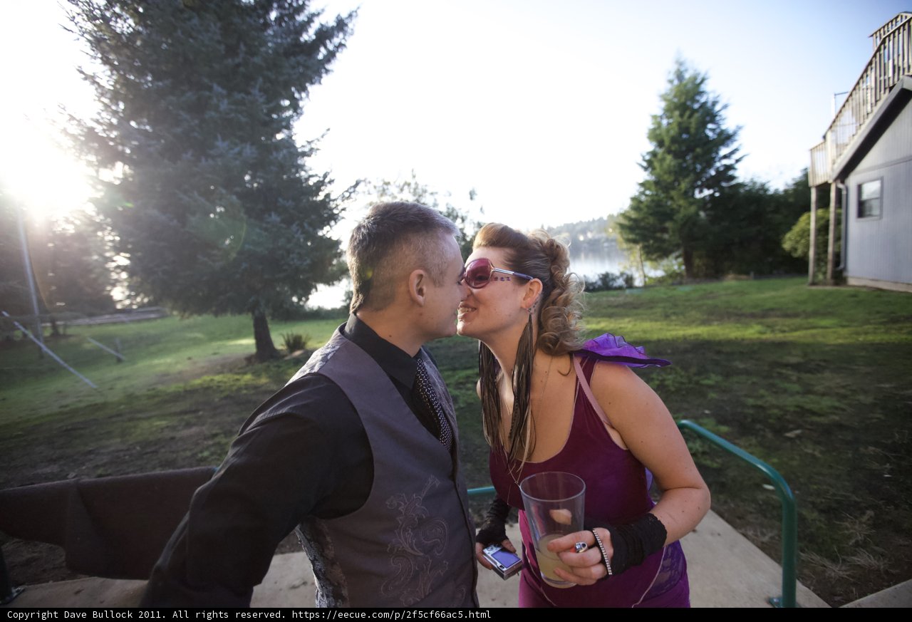 A Romantic Wedding Kiss under the Trees