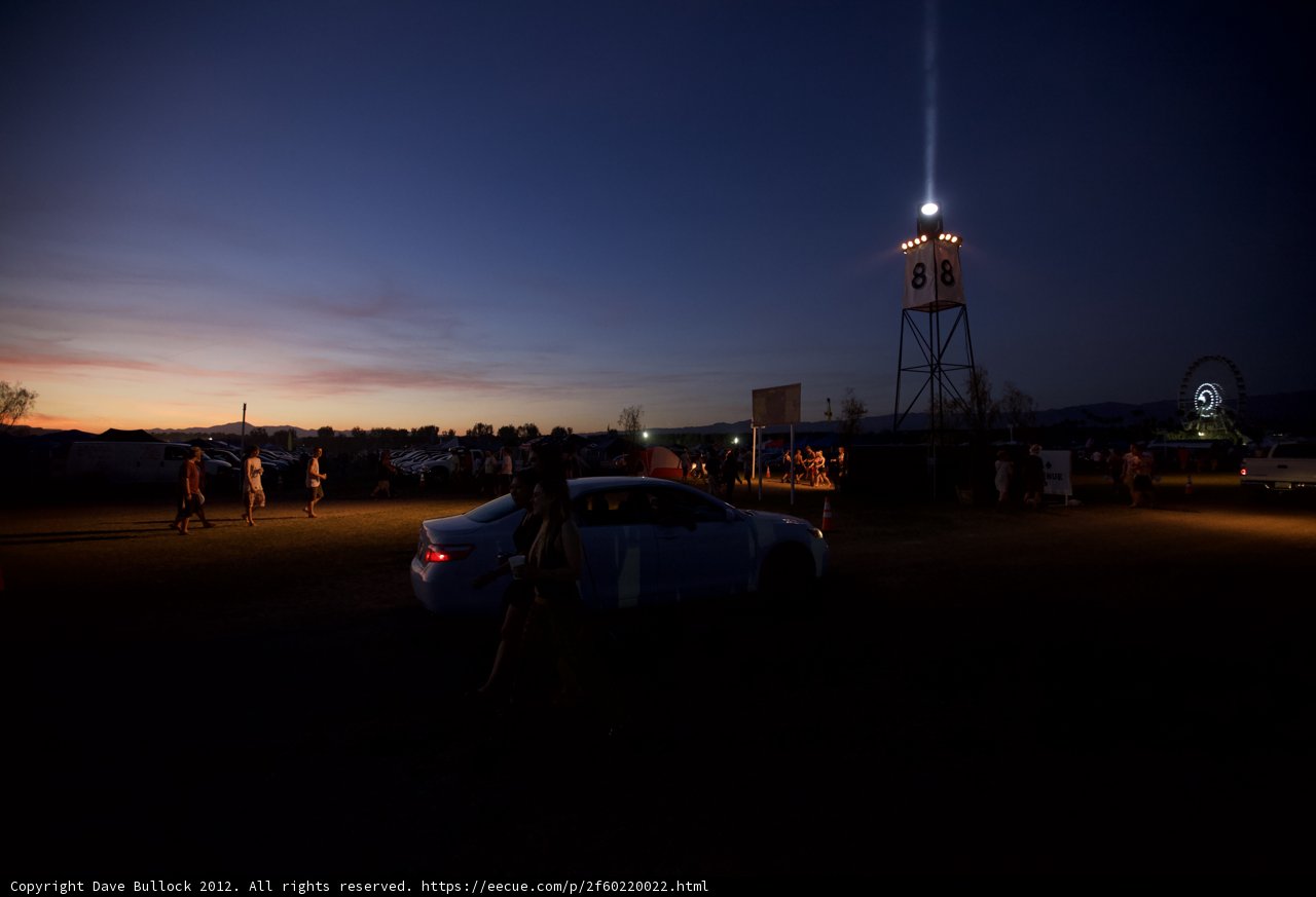 Parked Car by Light Tower at Dusk